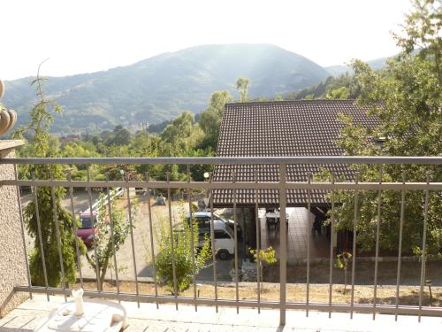 a house with a balcony with a view of a mountain at Agriturismo Le Giare in Genova