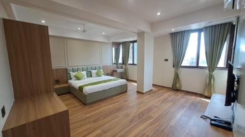 Ένα ή περισσότερα κρεβάτια σε δωμάτιο στο Sai Inn