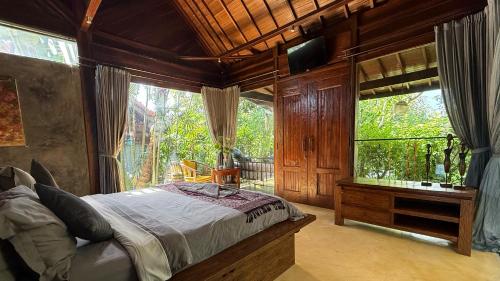 Postel nebo postele na pokoji v ubytování Maso Christian Villa