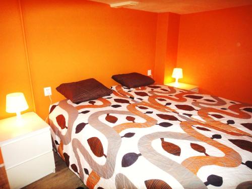 Llit o llits en una habitació de Orange Suite Studio
