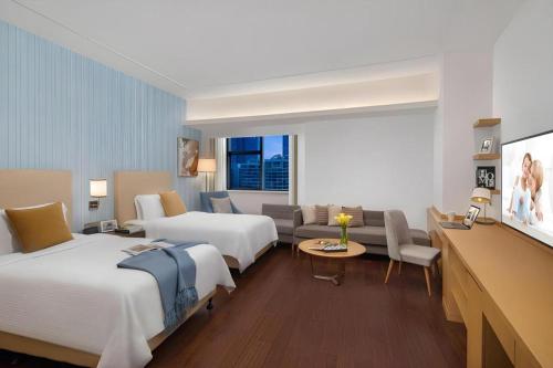 Ένα ή περισσότερα κρεβάτια σε δωμάτιο στο Somerset Software Park Xiamen