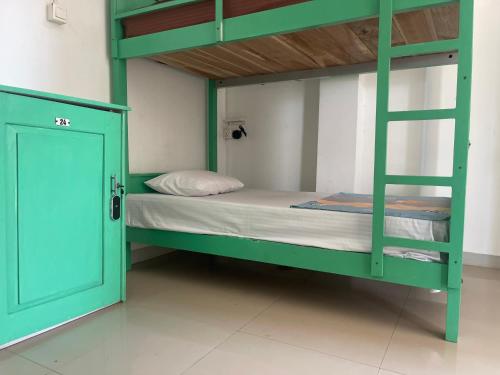 Ένα ή περισσότερα κρεβάτια σε δωμάτιο στο Ishu beach hostel