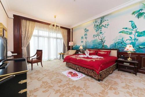 - une chambre avec un grand lit rouge dans l'établissement Evergrande Hotel Guangzhou Zengcheng, à Zhongxin