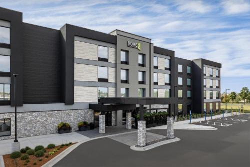 a rendering of a hotel with a parking lot at Home2 Suites By Hilton Ramsey in Ramsey