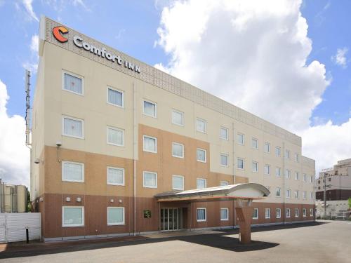 a building with a c constituent inn sign on it at Comfort Inn Nagasaki Airport in Omura