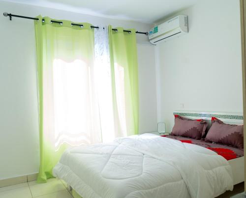 Ένα ή περισσότερα κρεβάτια σε δωμάτιο στο Lagoon Suites