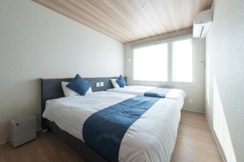 Ένα ή περισσότερα κρεβάτια σε δωμάτιο στο HIGASHIKAWA Villa 瑞月