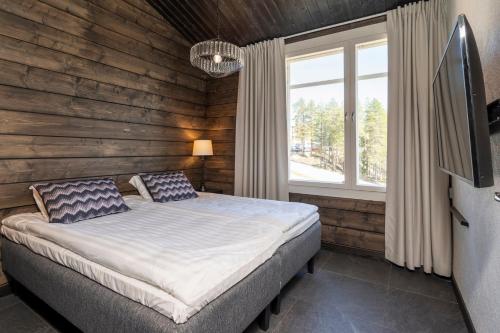 Postel nebo postele na pokoji v ubytování Ski-inn Pyhälinna Deluxe Villas