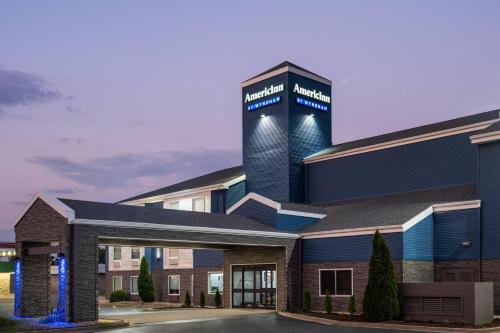 a rendering of the front of a hospital building at AmericInn by Wyndham Urbana Champaign University Area in Champaign