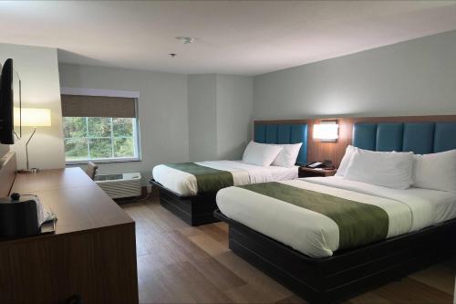 Ένα ή περισσότερα κρεβάτια σε δωμάτιο στο Wingate by Wyndham Macon West I-475