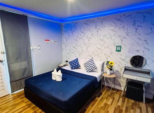 a bedroom with a bed and a piano at Viphuanan Resort in Nong Prue