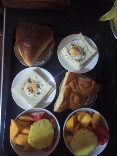 a tray of food with different types of food at Nine arch eco Villa Ella in Ella