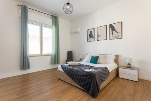 Postel nebo postele na pokoji v ubytování Casa Levante - Near the station and city center