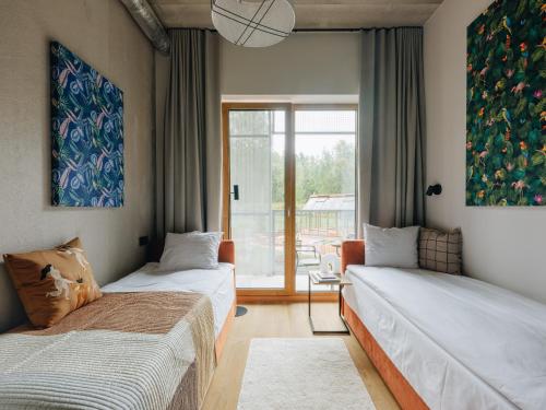 Voodi või voodid majutusasutuse Sume by Larsen toas