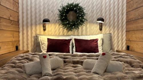 En eller flere senge i et værelse på Luxury City Cottage