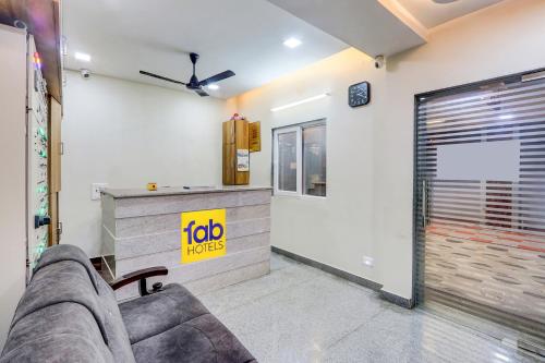 a living room with a couch and a counter at Hotel Narayan Villa in Rājahmundry