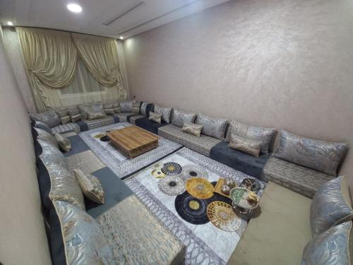 an overhead view of a living room with a couch at Appartement a Louer Laayoune in Laayoune