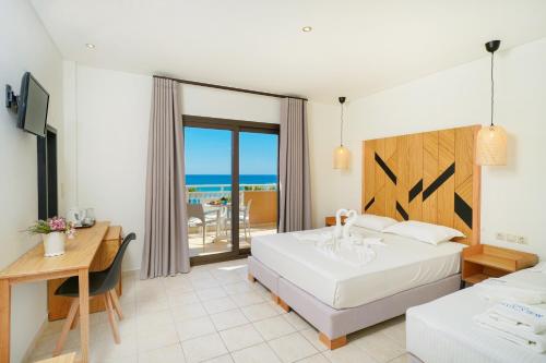 Ένα ή περισσότερα κρεβάτια σε δωμάτιο στο Blue view seaside hotel