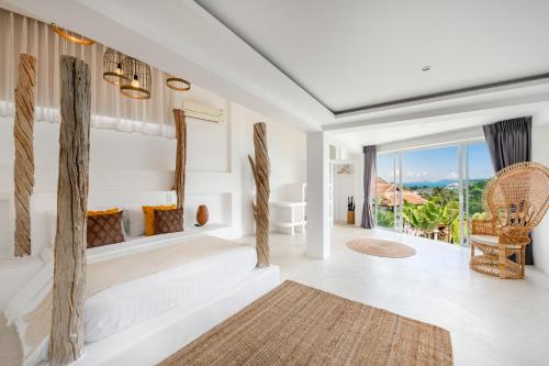 Postel nebo postele na pokoji v ubytování Villa SAYAM, vue mer panoramique & piscine infinity privée à Bophut