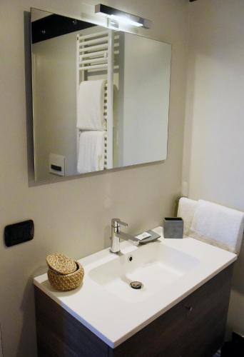 a bathroom with a sink and a mirror at San Francesco Suite in Poggio Bustone