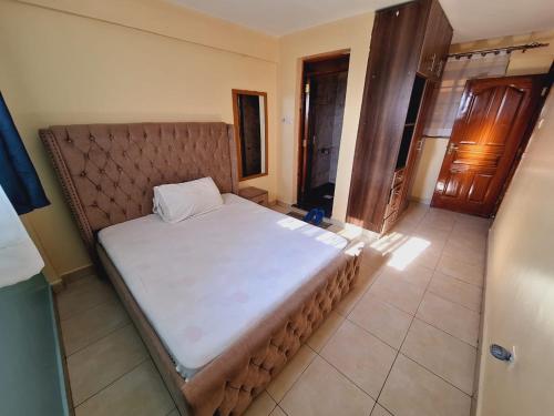 Postel nebo postele na pokoji v ubytování Umoja House