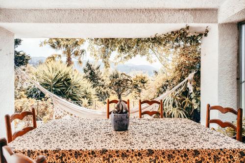 a table with a vase sitting on top of it at Casa da Rampa By Gt House in Sintra