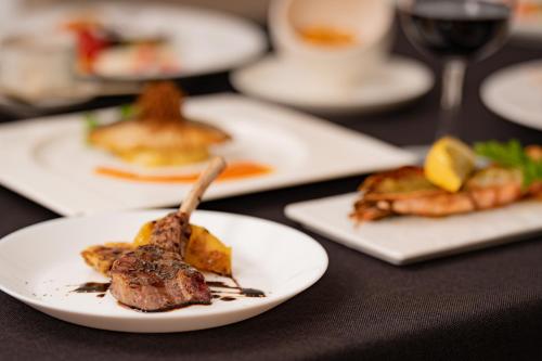 a group of plates of food on a table at Karuizawa Tennku Hotel & Resort in Karuizawa