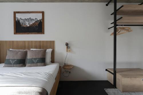 Ένα ή περισσότερα κρεβάτια σε δωμάτιο στο Cosy Alpine Chic Studio