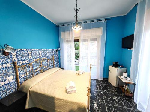 Postel nebo postele na pokoji v ubytování B&B Amàre