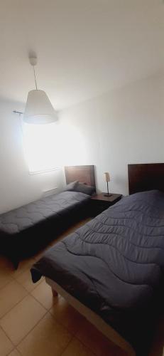 Postel nebo postele na pokoji v ubytování Résidence Claire Rive appartement 16