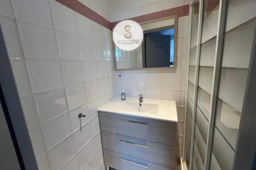 a bathroom with a sink and a mirror at Emily in Provence Arles Centre in Arles