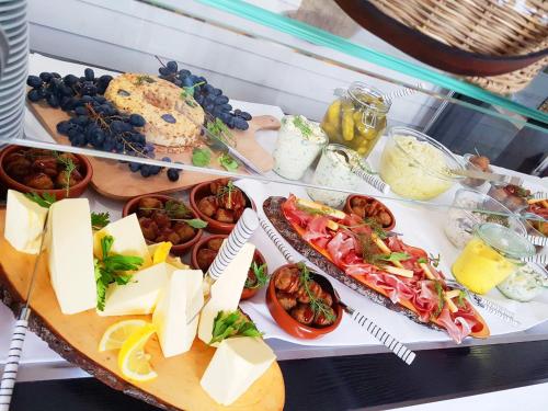 a table with a variety of food on it at Suite Hotel Binz Familienhotel Rügen in Binz