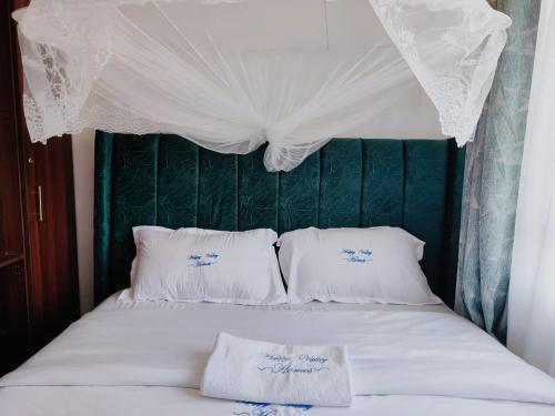 Ένα ή περισσότερα κρεβάτια σε δωμάτιο στο Happy B Homes