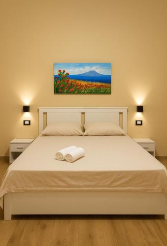 Ένα ή περισσότερα κρεβάτια σε δωμάτιο στο Etna Charme Guest House