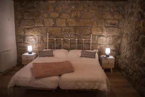 Ένα ή περισσότερα κρεβάτια σε δωμάτιο στο Arrutela