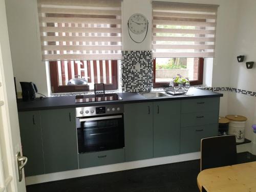 Kuchyň nebo kuchyňský kout v ubytování Fewo Hein Da Sein