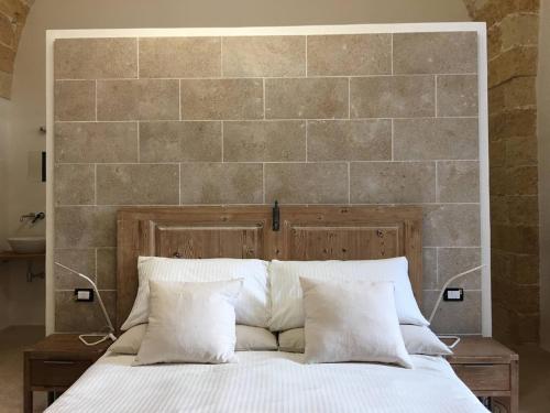 Ένα ή περισσότερα κρεβάτια σε δωμάτιο στο CasaFrancisa Dimora storica 1830