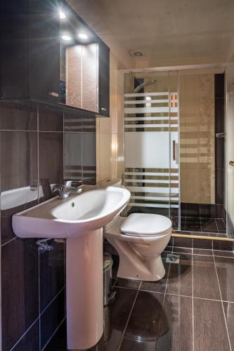 a bathroom with a sink and a toilet at Sokaki in Megalo Chorio