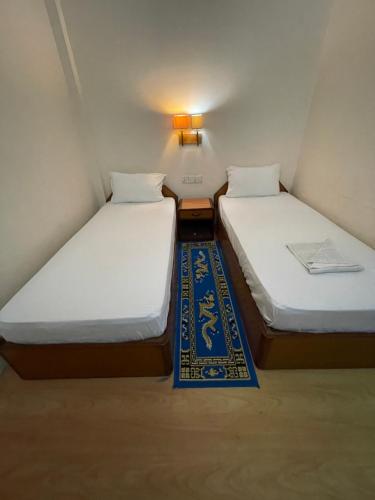 En eller flere senge i et værelse på New Buddha Bhoomi Guest House