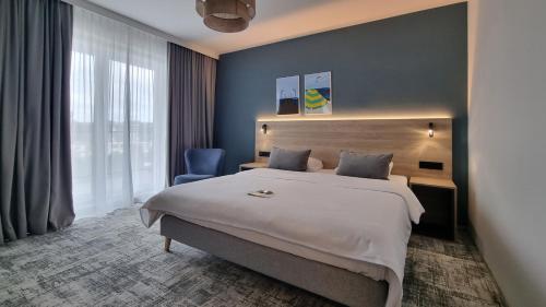 Llit o llits en una habitació de Hotel Wolin
