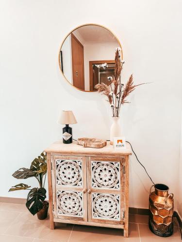 a mirror on top of a dresser in a room at Cosy Apartment Queluz By Gt House in Queluz