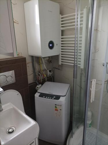 a small bathroom with a toilet and a sink at Karolína 2 in Plavecký Štvrtok