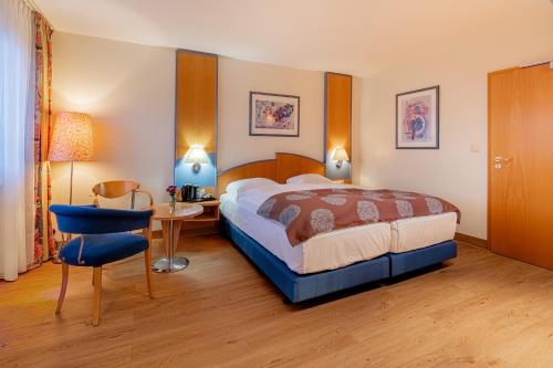 Postel nebo postele na pokoji v ubytování Hotel Karl