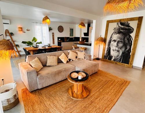 a living room with a couch and a table at Sand and Style, Baie Orientale in Saint Martin