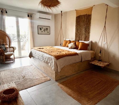 a bedroom with a large bed in a room at Sand and Style, Baie Orientale in Saint Martin