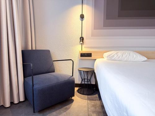 Ένα ή περισσότερα κρεβάτια σε δωμάτιο στο Ibis Alès Centre Ville