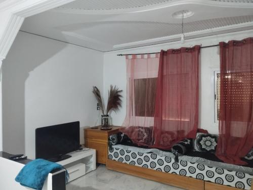 Μια τηλεόραση ή/και κέντρο ψυχαγωγίας στο Super appartement quartier paisible proches toutes commodités