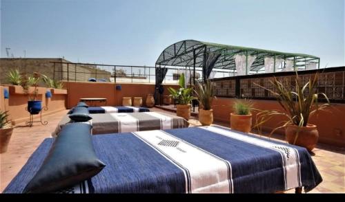 Ένα ή περισσότερα κρεβάτια σε δωμάτιο στο Riad Razane Fez