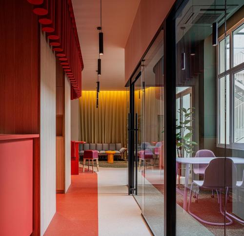 a hallway with glass doors and a dining room at Colegio Mayor Resa La Concepción in Valencia