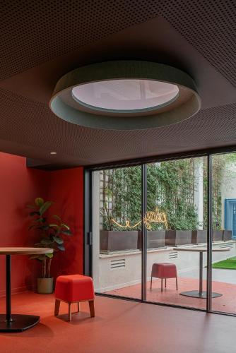 a room with a table and two chairs and a ceiling at Residencia Universitaria Resa La Concepción in Valencia